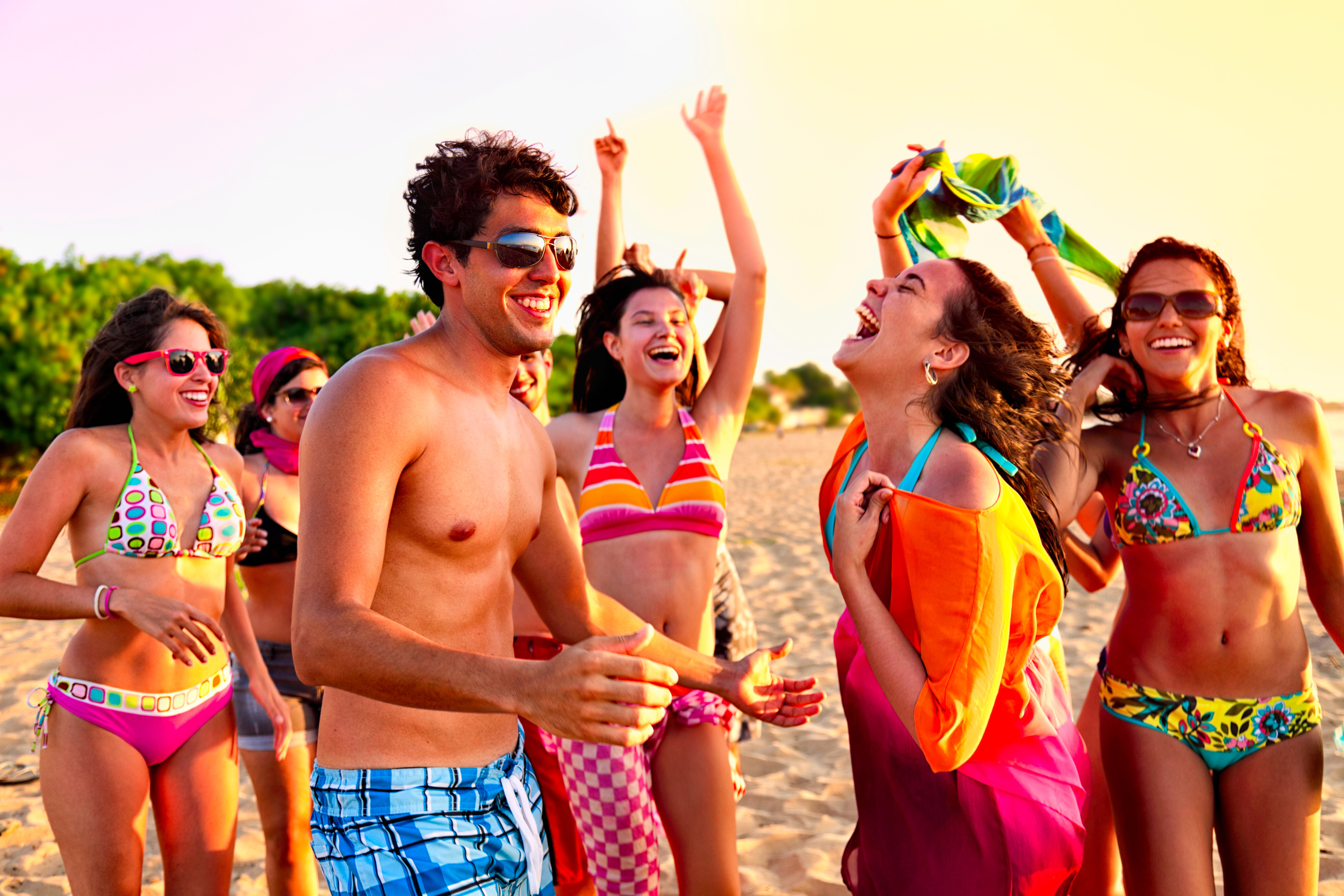 Group of young people at a spring break beach party